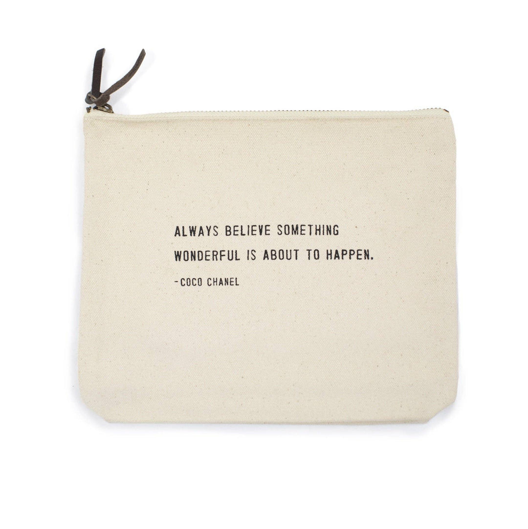 Canvas zip bag with black text reading “Always believe something wonderful is about to happen. – Coco Chanel.”