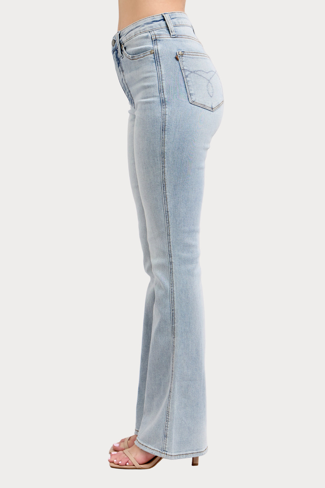 Light blue jeans worn by a person on a white background
