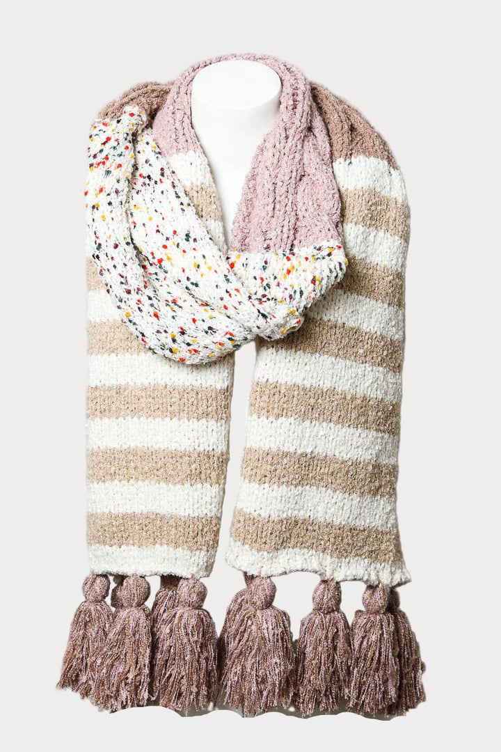 Boho striped knit scarf with tassels and speckled detailing in beige, cream, and blush tones.