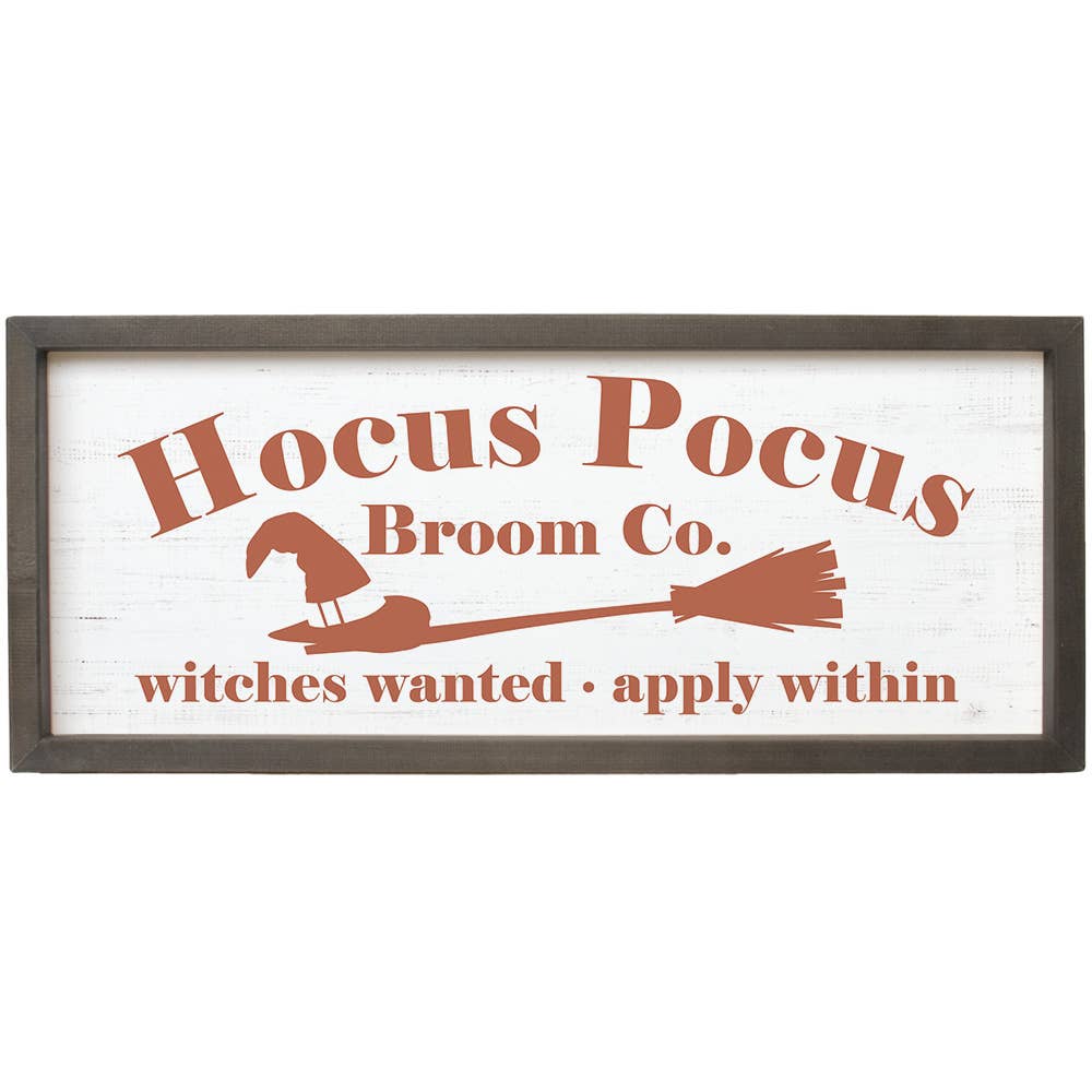 Decorative sign with 'Hocus Pocus Broom Co.' text and witch hat and broom illustration on a white background.