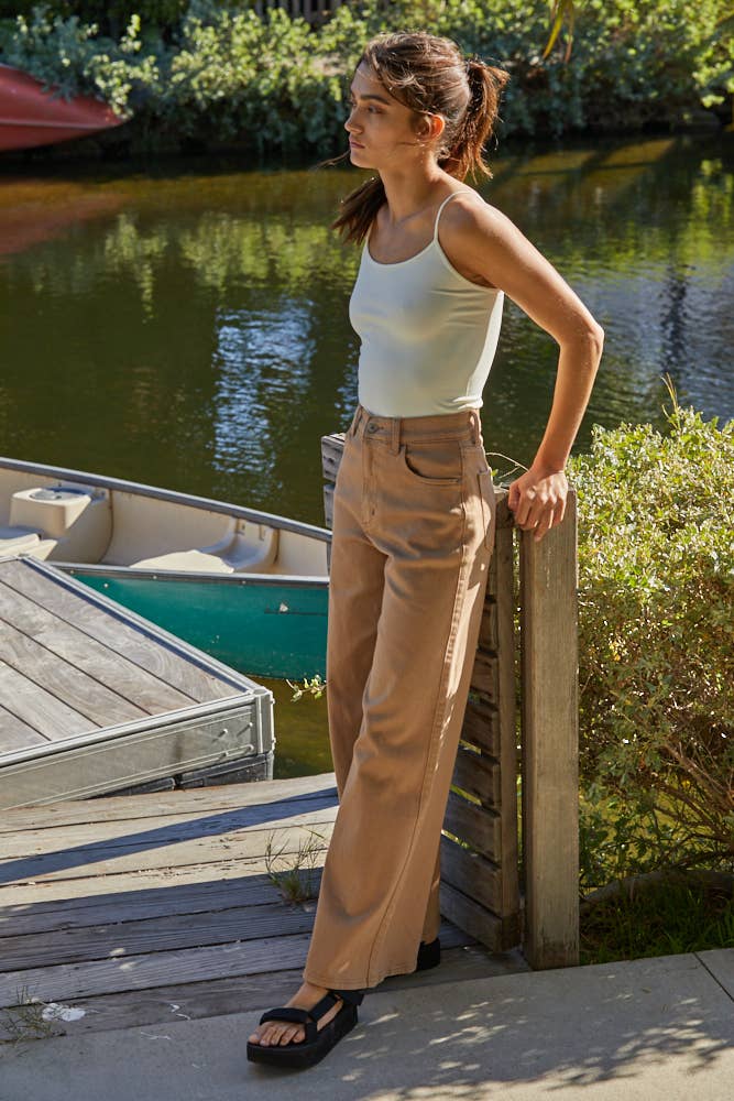 Seamless ivory full-length cami with thin straps, styled with khaki denim for a sleek everyday look.
