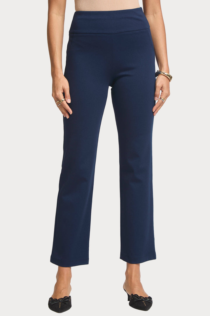 Navy blue pants worn by a person on a white background