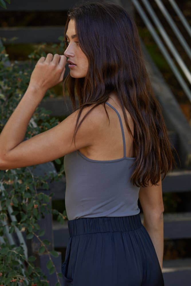Seamless slate grey full-length cami with thin straps, styled with joggers for a sleek everyday look.