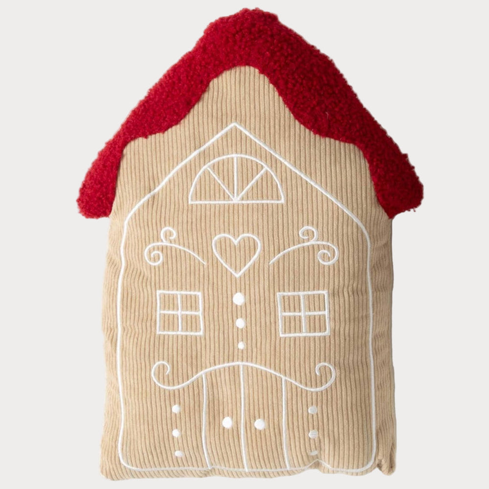 Corduroy gingerbread house pillow with red roof and white embroidered details