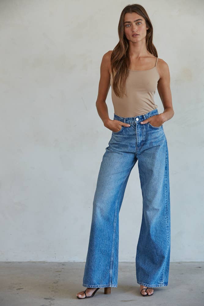 Seamless taupe full-length cami with thin straps, styled with denim for a sleek everyday look.
