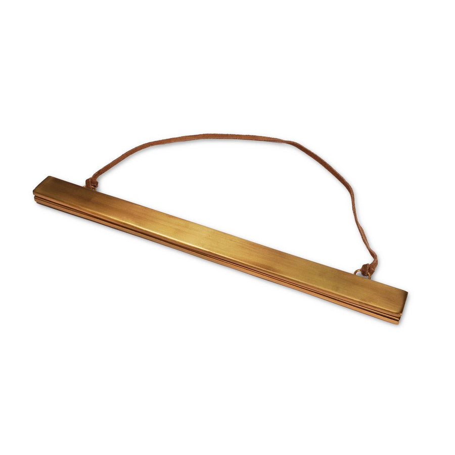 Brass magnetic strip frame with modern minimalist design for easy photo display