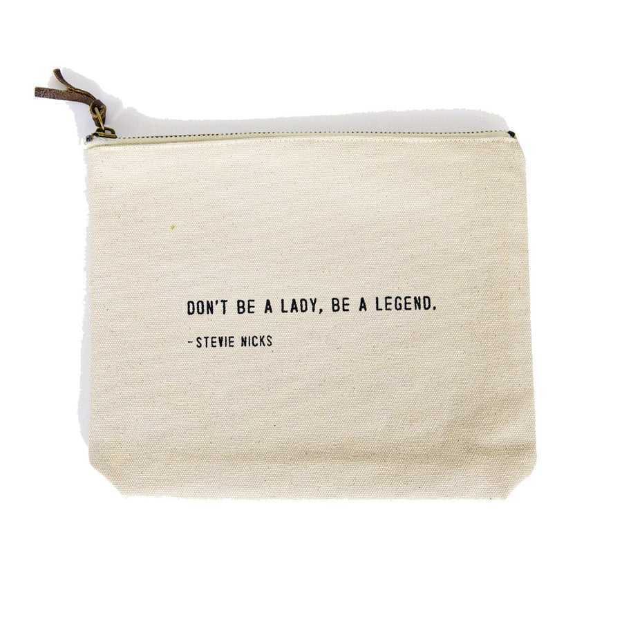 Canvas zip bag with black text reading “Don’t be a lady, be a legend. – Stevie Nicks”