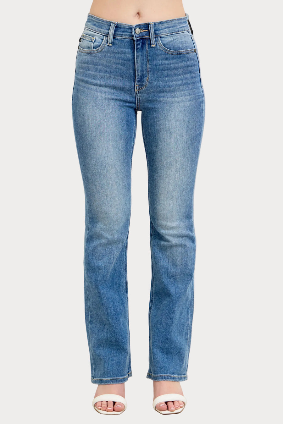 Model wearing high waist contrast wash bootcut jeans with classic stretch denim fit