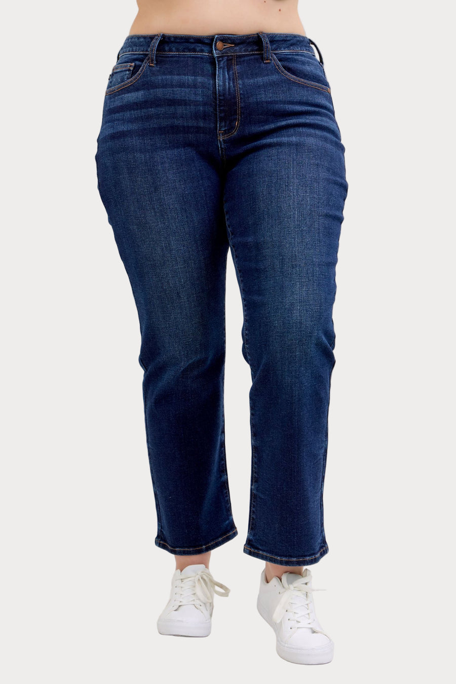 Model wearing Judy Blue mid-rise dark wash straight jeans with a short 30-inch inseam