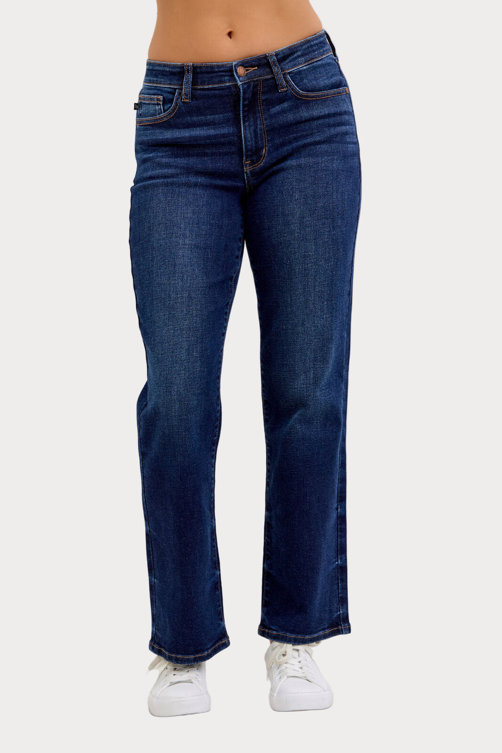 Model wearing Judy Blue mid-rise dark wash straight jeans with a short 30-inch inseam