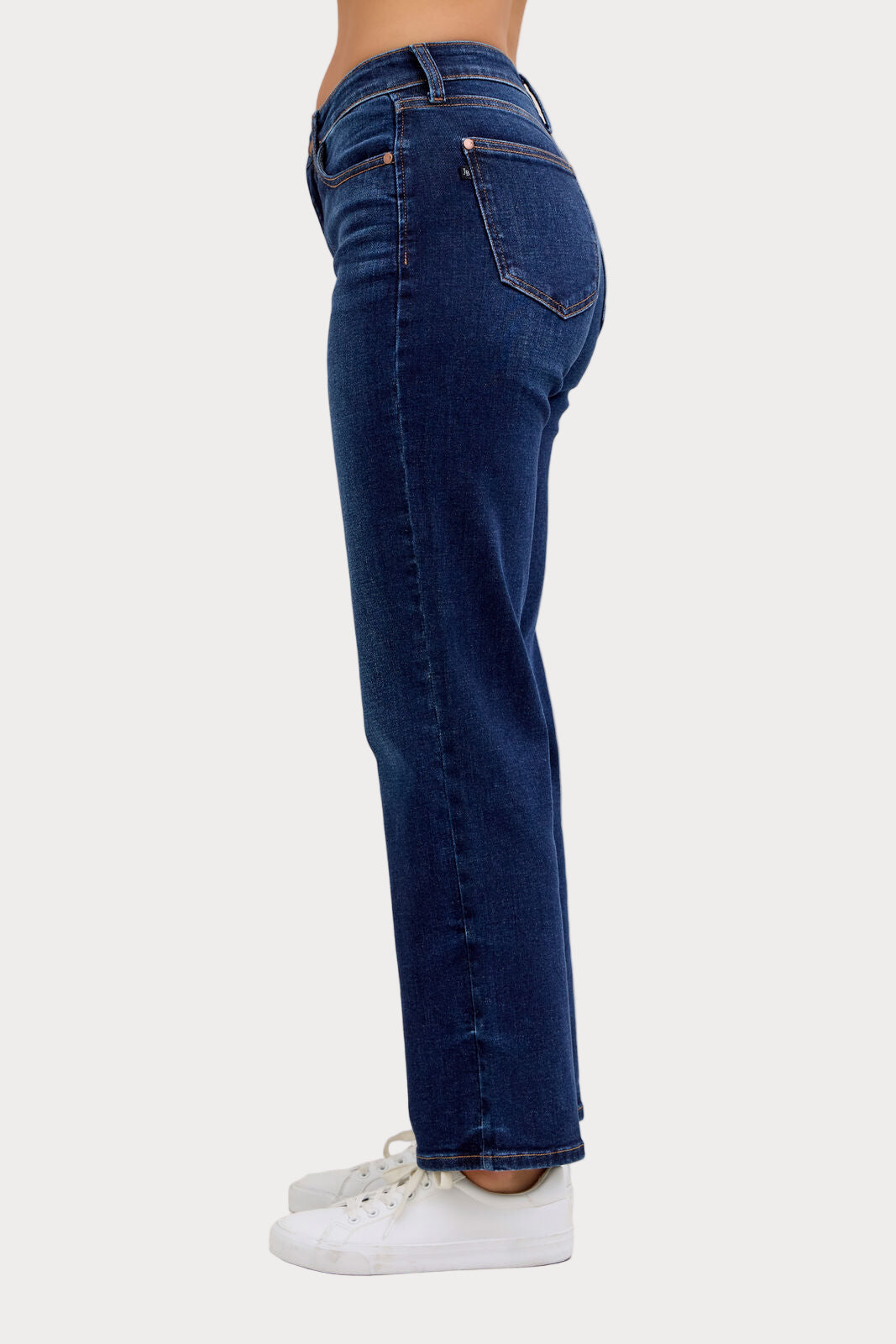Model wearing Judy Blue mid-rise dark wash straight jeans with a short 30-inch inseam