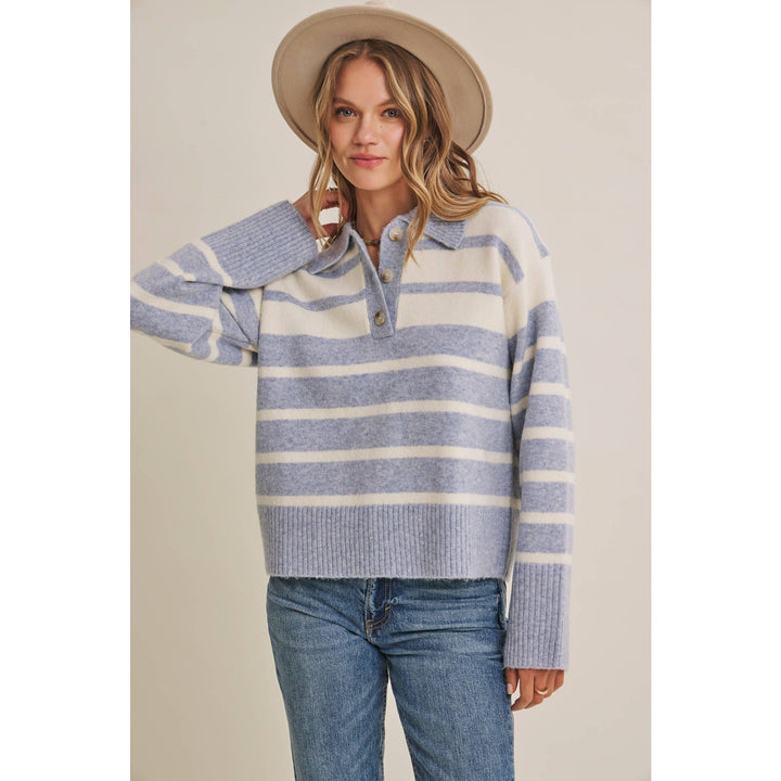 Woman wearing The Marlowe ice blue and ivory striped brushed Henley sweater with blue jeans