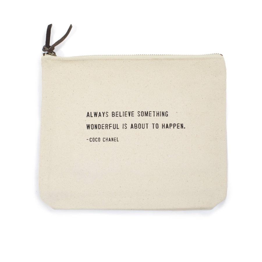 Canvas zip bag with black text reading “Always believe something wonderful is about to happen. – Coco Chanel.”