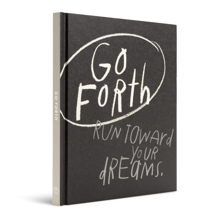 Black notebook with motivational quote on a white background