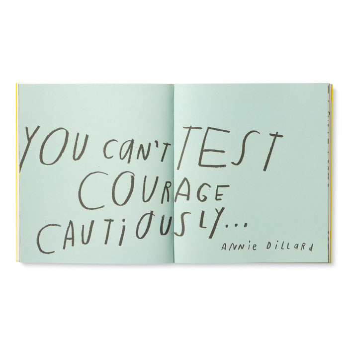 Open book with handwritten text on a light green background