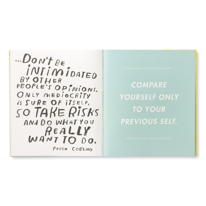 Open book with inspirational quote on two pages