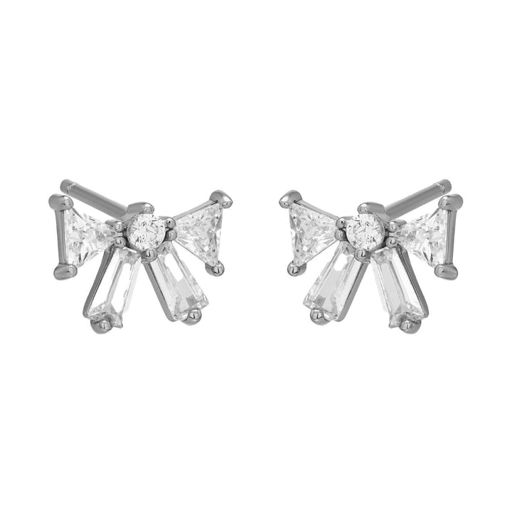 Silver bow-shaped stud earrings with baguette and triangular CZ stones.