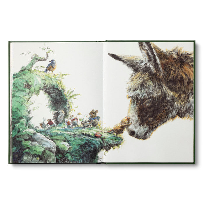 Illustrated book open to a page with a donkey looking at a magical landscape with small creatures and a bird.