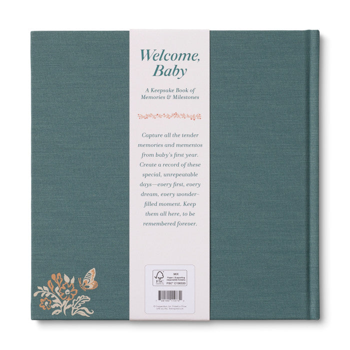 Teal keepsake book with white text and floral design on a white background
