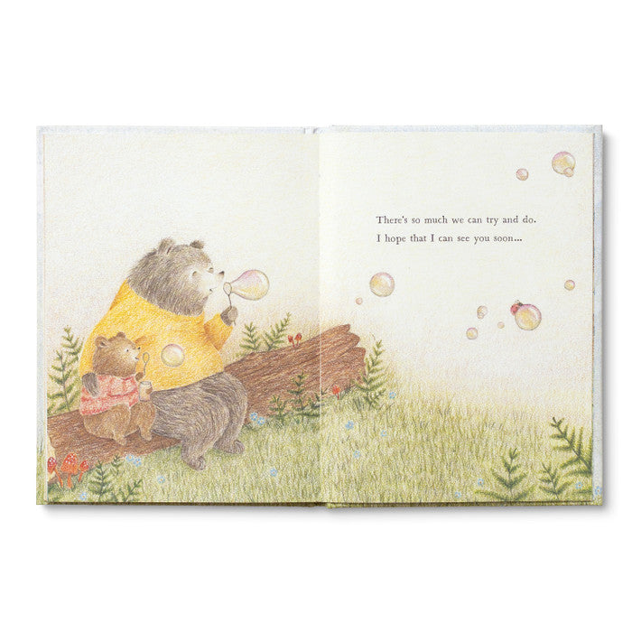 Illustrated book page with two bears sitting together on a log blowing bubbles.