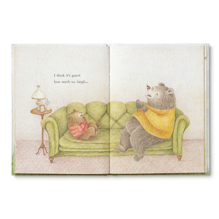 Illustrated book open to two pages showing two bears on a couch with text.