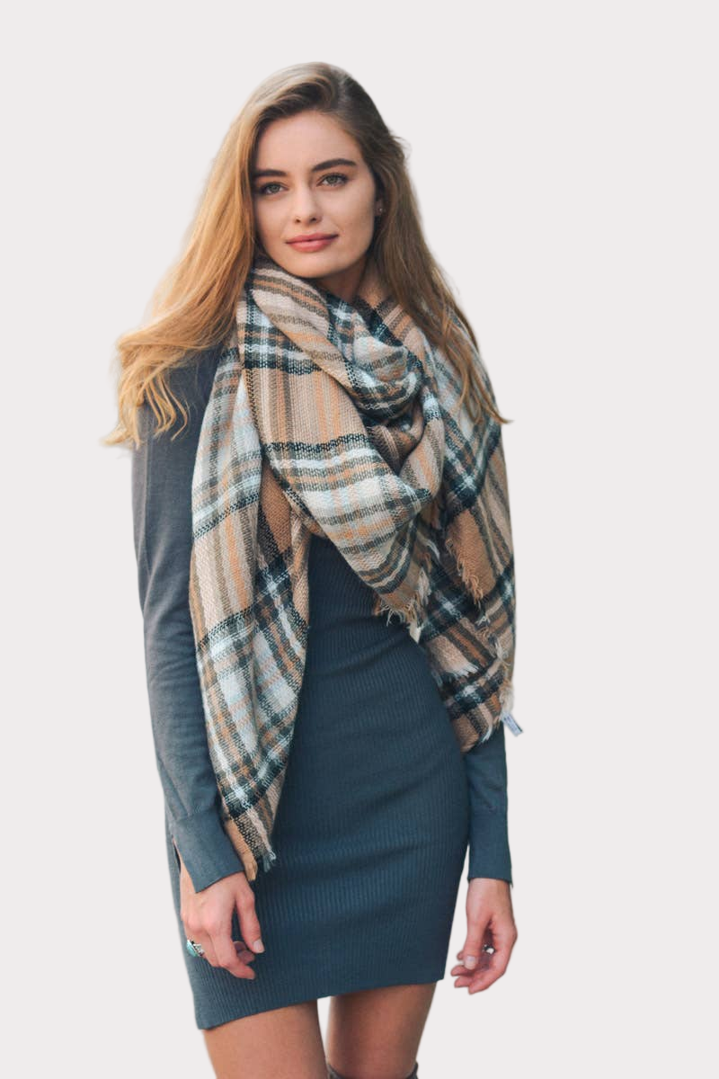 Plaid flannel scarf with frayed edges in warm tan, cream, and slate tones—cozy fall accessory.