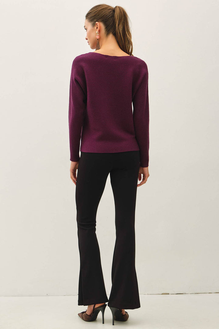 Be Cool The Shelby Sweater in deep plum purple featuring a ribbed knit, boat neckline, long dolman sleeves, and relaxed hip-length fit.