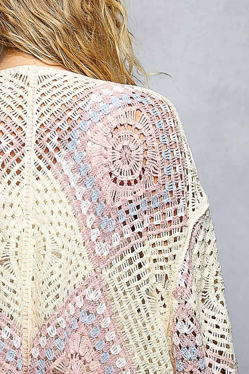 Close-up of a Crochet granny square cardigan with open front and relaxed fit