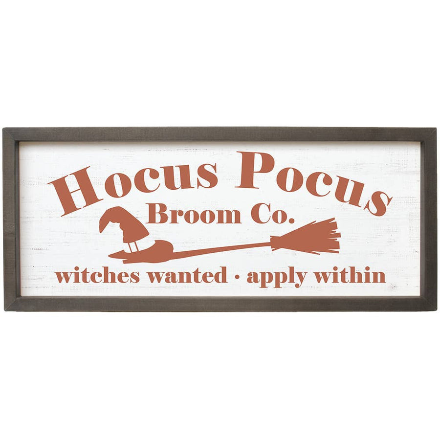 Decorative sign with 'Hocus Pocus Broom Co.' text and witch hat and broom illustration on a white background.