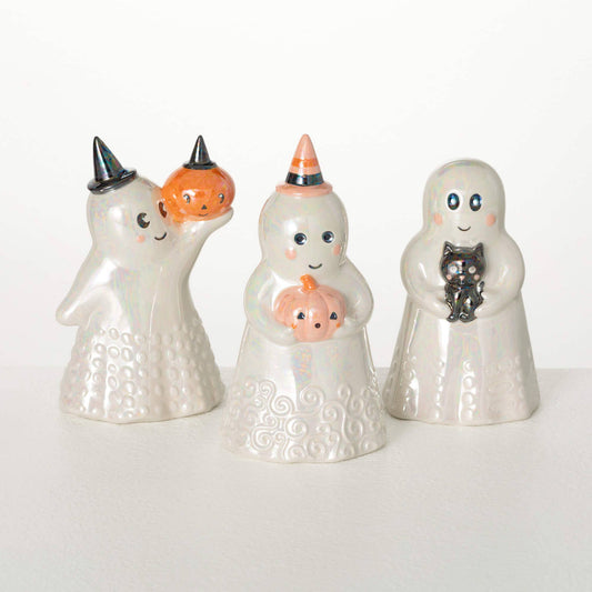 Set of four Halloween-themed ceramic figures on a white background