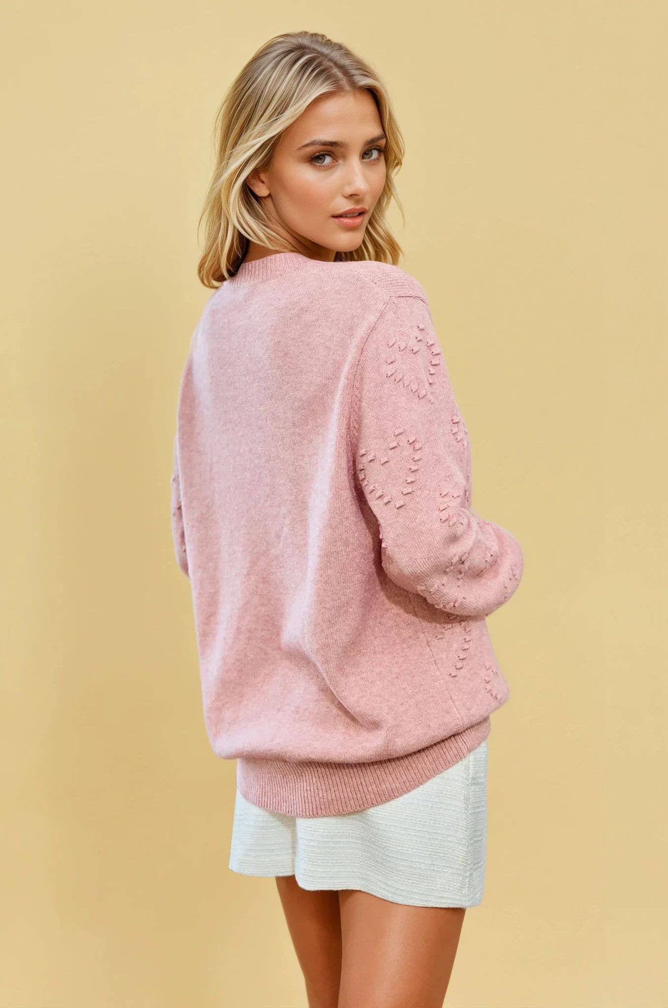 KNIT SWEATER TOP WITH HEART SHAPE DETAIL