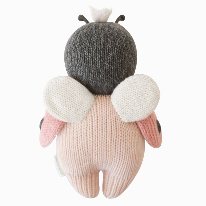 Knitted ladybug toy showing back & wings with a white background
