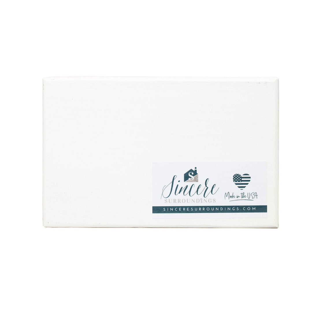 Back of block with 'Sincere Surroundings' branding on a white background