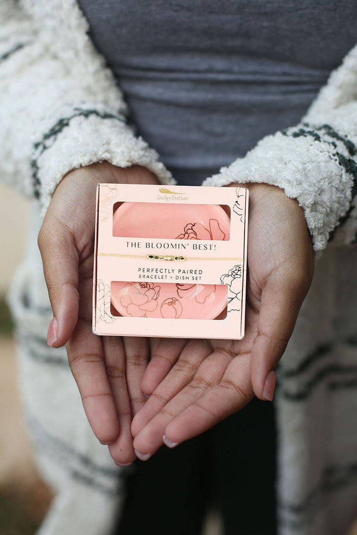 person holding The Bloomin' Best bracelet and floral trinket dish gift set with pink and gold accents