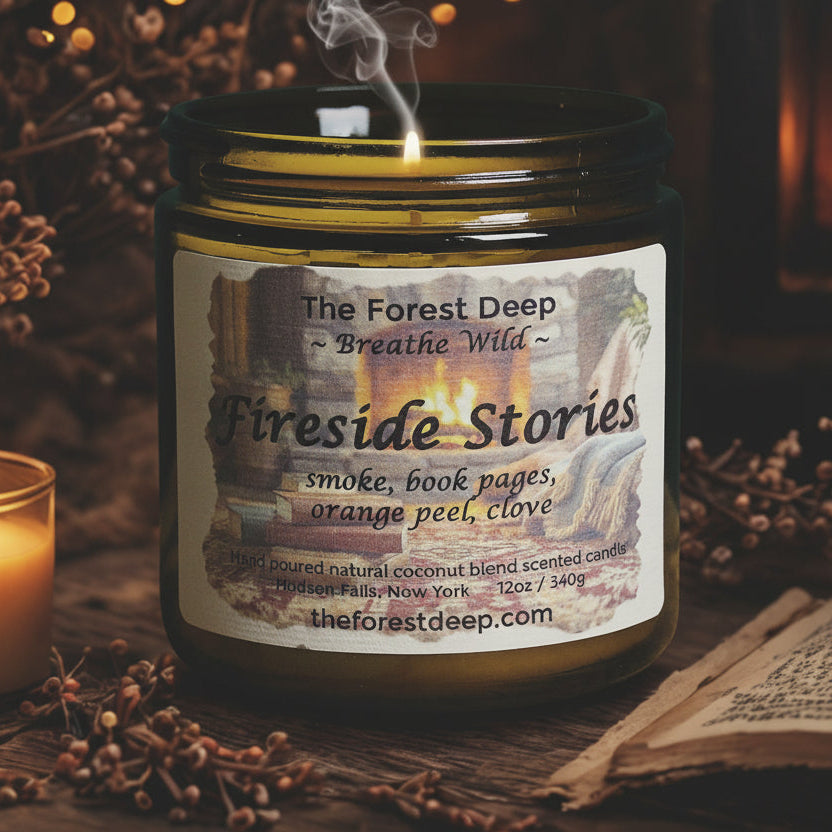 Candle jar labeled 'Fireside Stories' with a lit candle and book in a cozy setting.