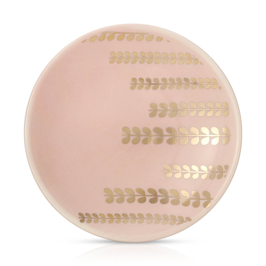 Round trinket dish with gold leaf patterns on a white background