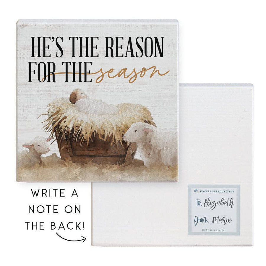 wood nativity block with “He’s the Reason for the Season” quote and writable back