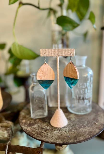 Handcrafted Aquamarine Birdseye Maple Earrings featuring natural maple wood grain, vibrant blue-green resin accents, and hypoallergenic stainless-steel hooks.