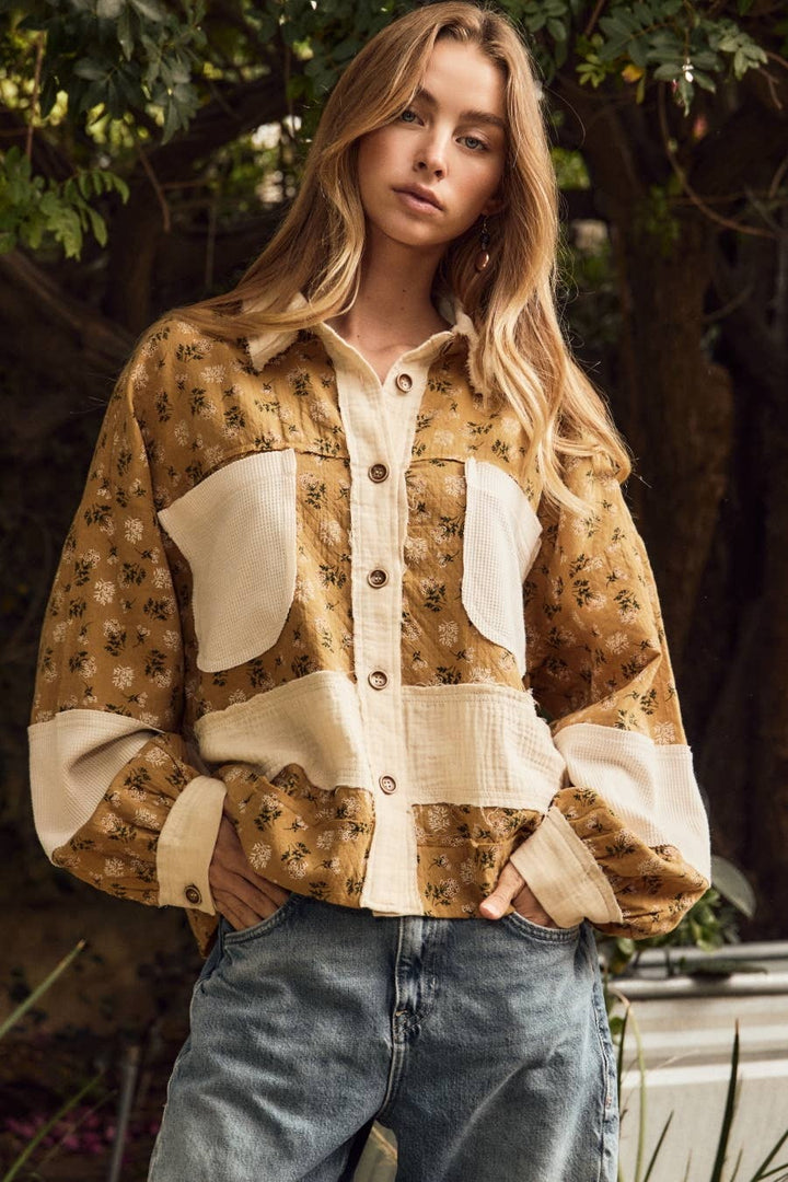 Golden floral mixed media shirt jacket with cream textured panels, oversized pockets.