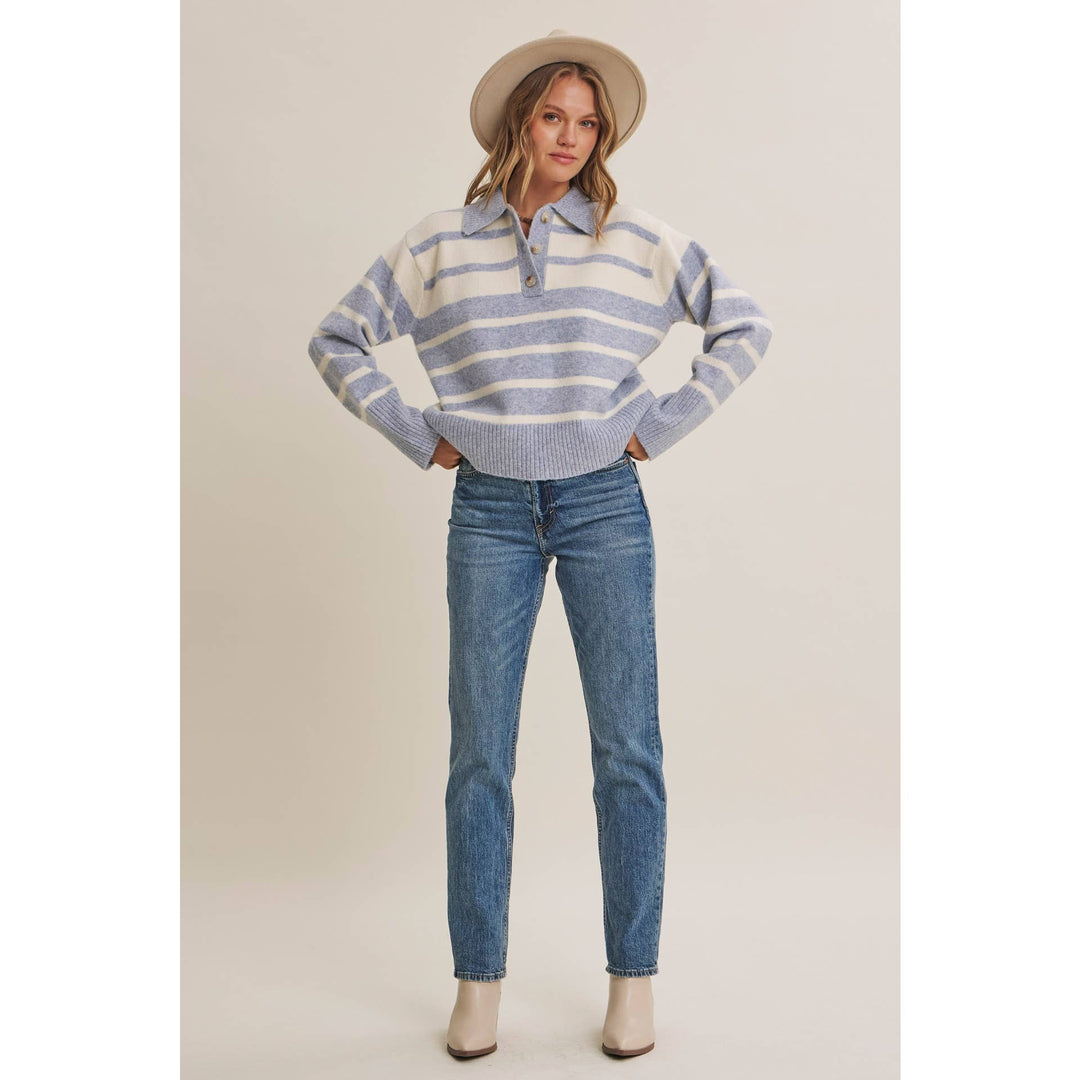 Woman wearing The Marlowe ice blue and ivory striped brushed Henley sweater with blue jeans
