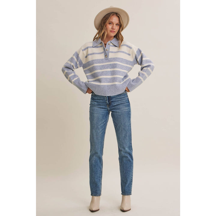 Woman wearing The Marlowe ice blue and ivory striped brushed Henley sweater with blue jeans