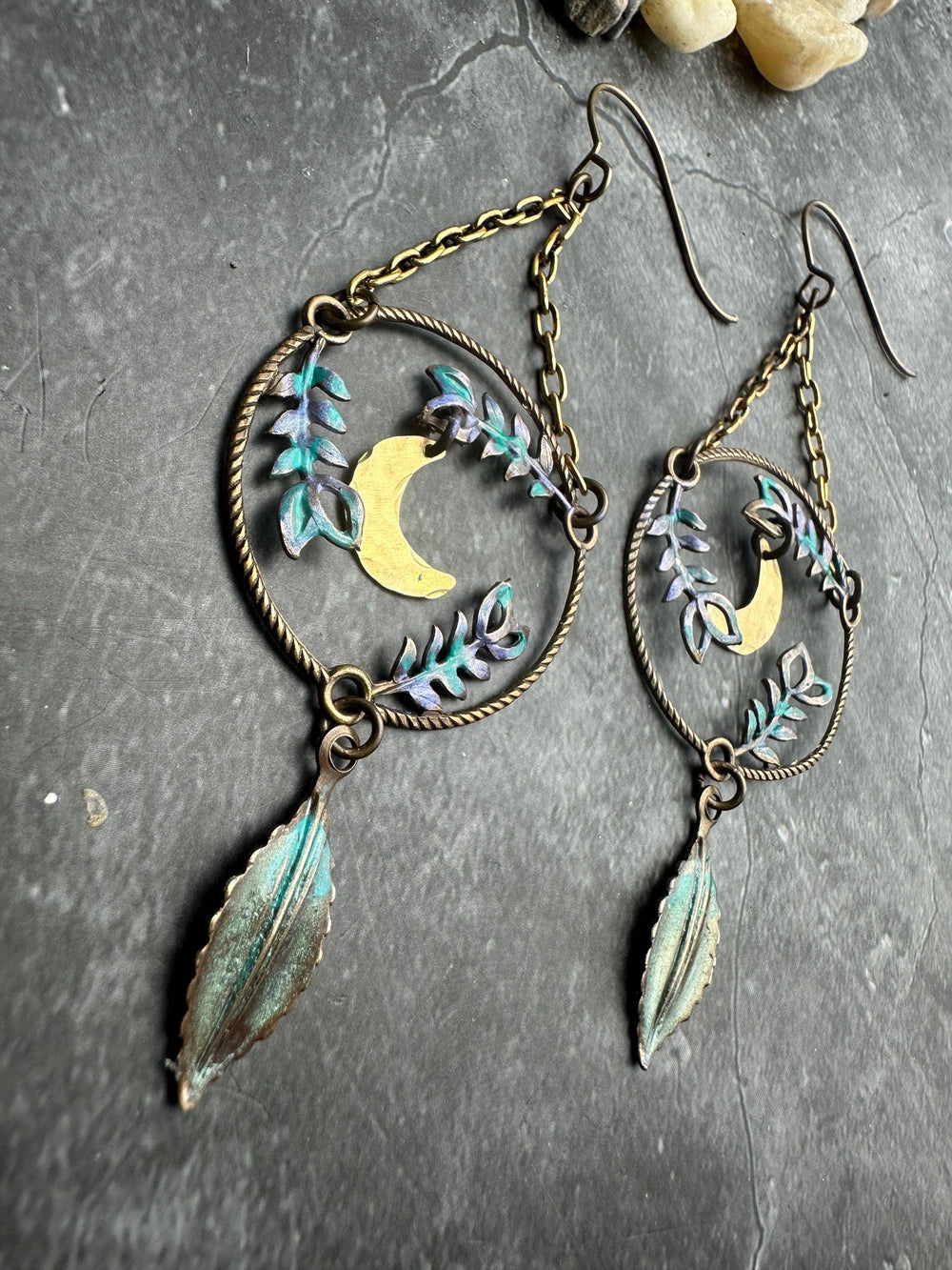 Handcrafted Fern Forest Moon Earrings with hammered brass crescent moons, botanical vines, iridescent patina accents and hanging leaf charms.