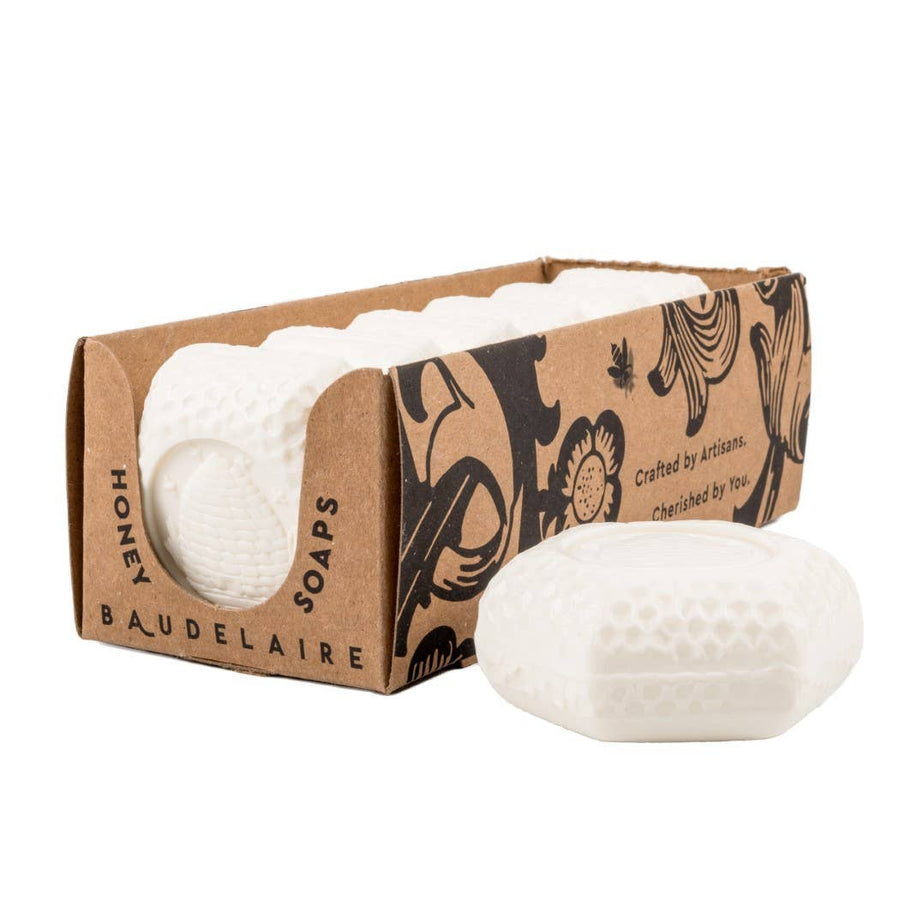 white goat’s milk honey soap bar with honeycomb texture in kraft box