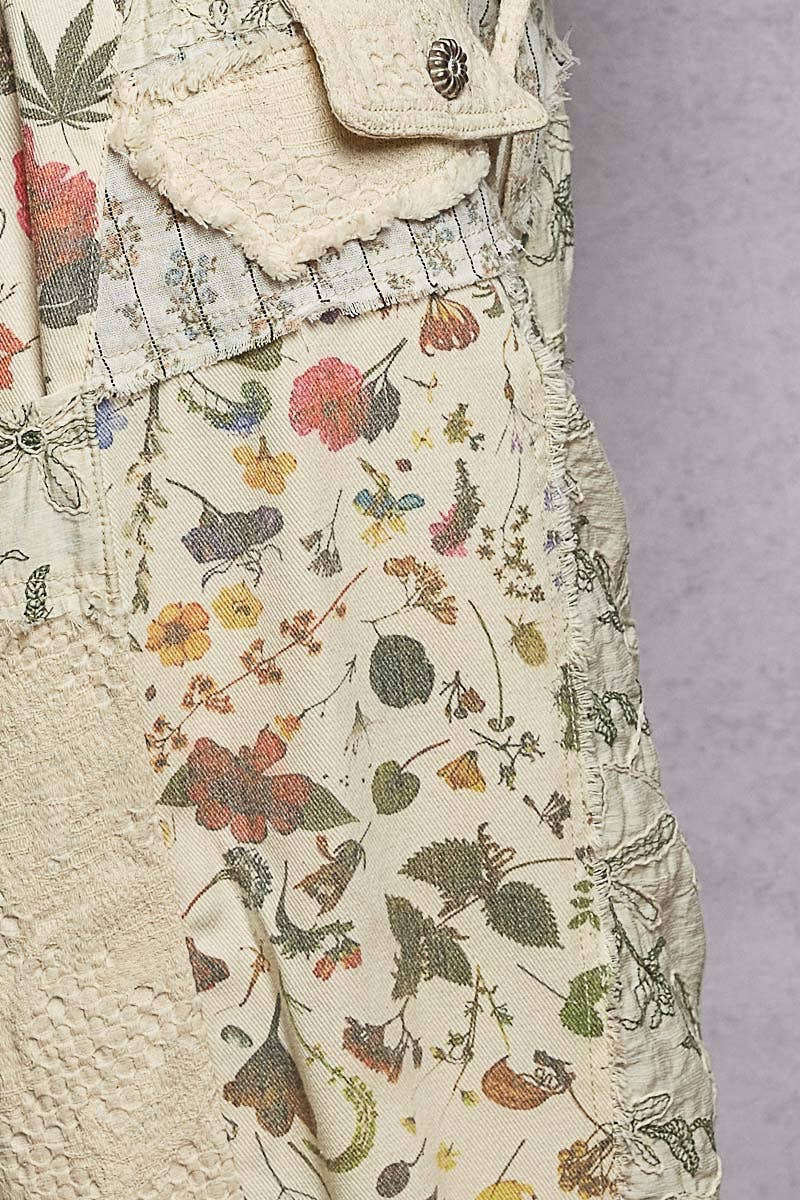Model wearing The Cottage Bloom Patchwork Joggers by POL featuring vintage-inspired floral patchwork, textured jacquard details, oversized utility pockets, and a relaxed bohemian silhouette.