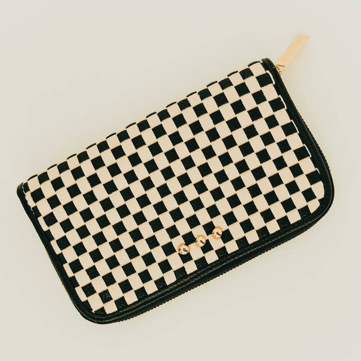 Large woven vegan leather zip wallet with black & white checkered design, organized interior compartments, and clutch-style silhouette.
