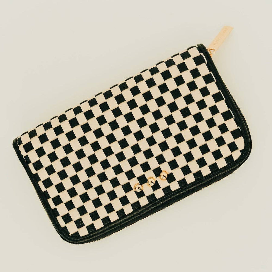 Large woven vegan leather zip wallet with black & white checkered design, organized interior compartments, and clutch-style silhouette.