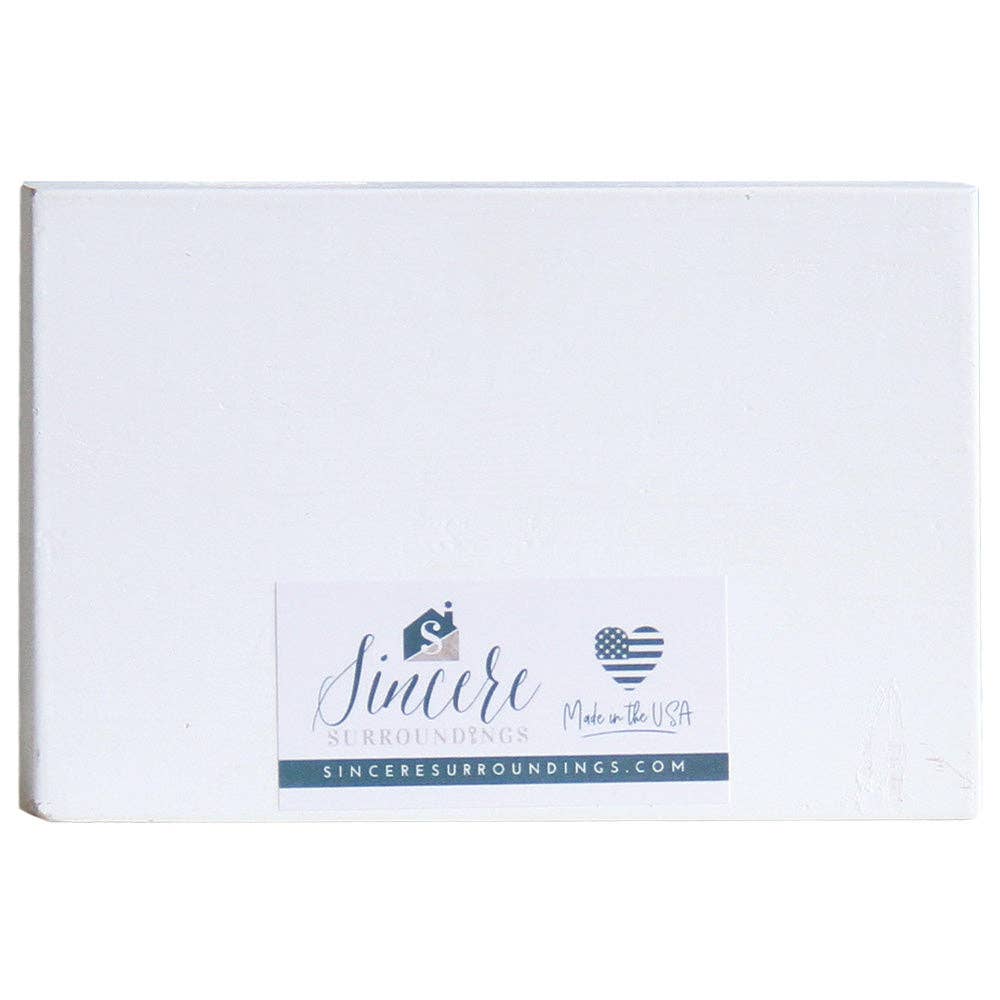 White block with 'Sincere Surroundings' branding on a white background