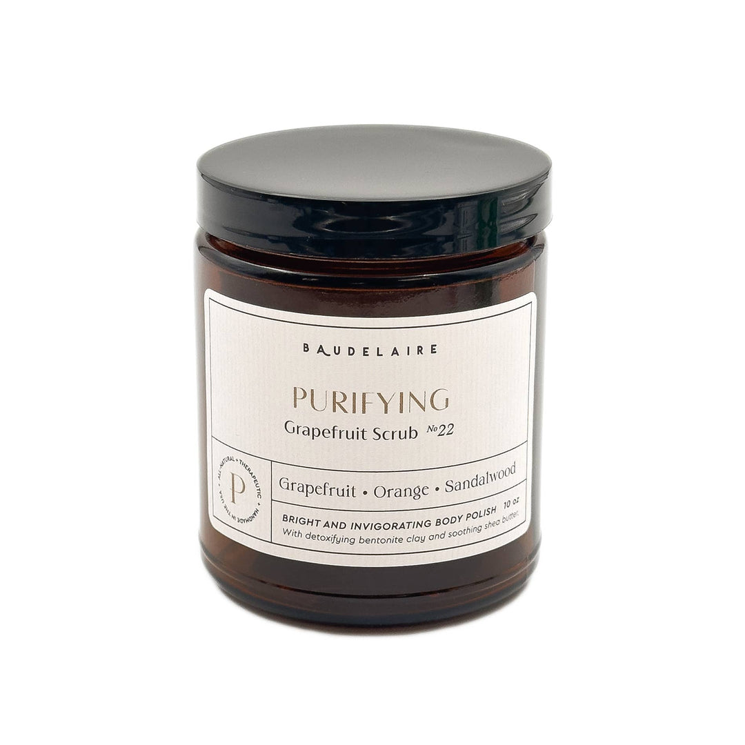 amber jar labeled purifying grapefruit scrub with citrus essential oil blend