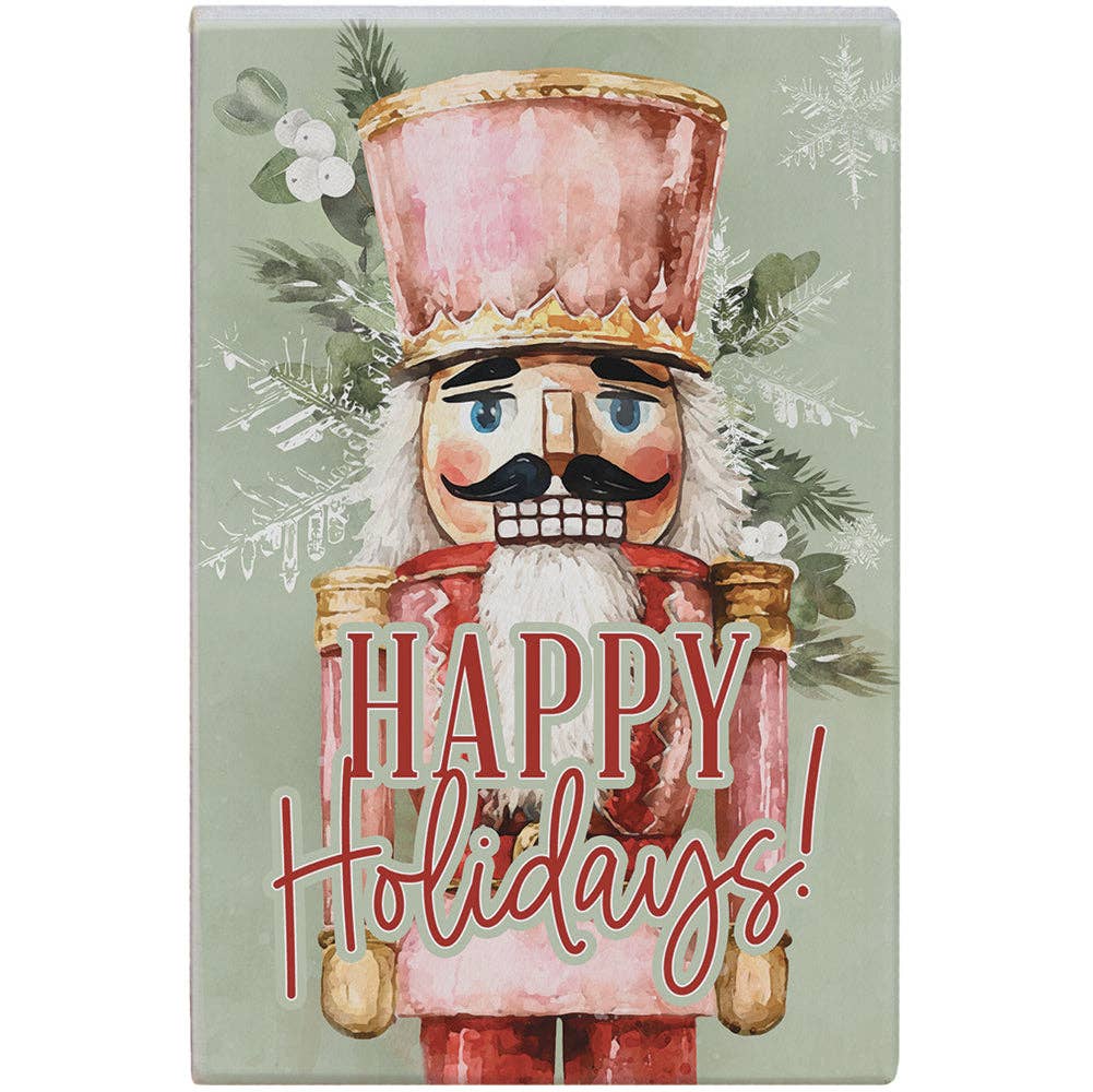wood art block with watercolor nutcracker and “Happy Holidays” text