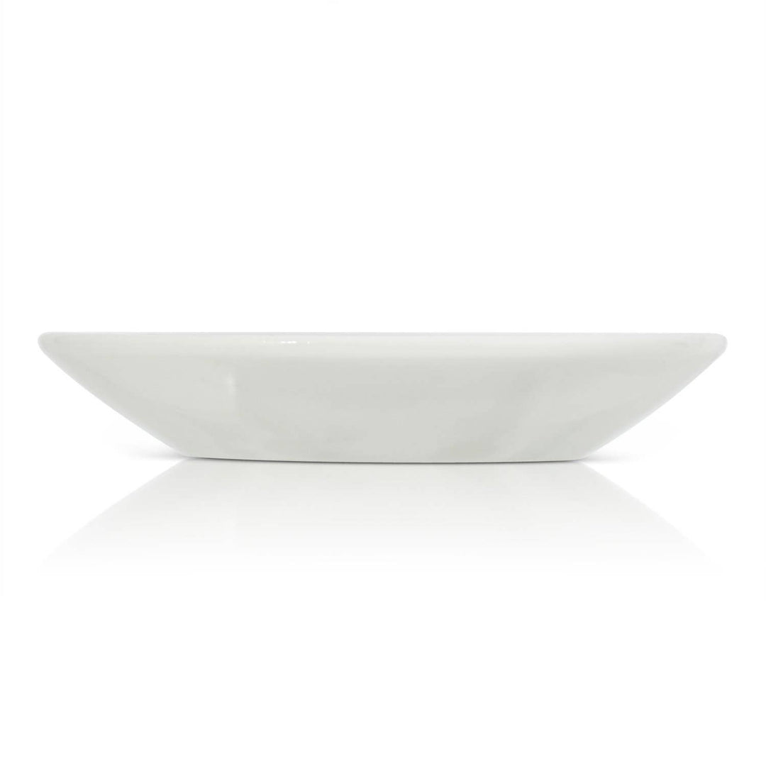 White ceramic trinket dish on a white background